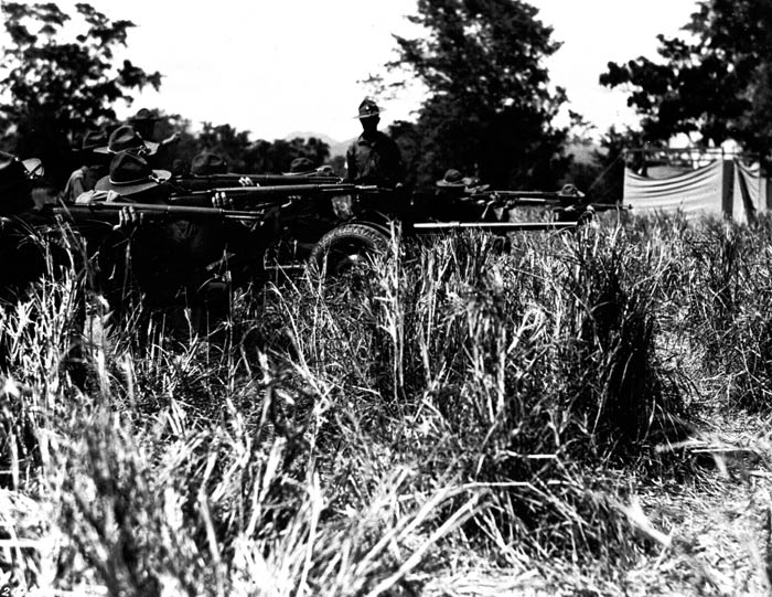 Troops of 65th Infantry ready for action at maneuvers, Salinas, Puerto Rico. 1941.  SC 121826